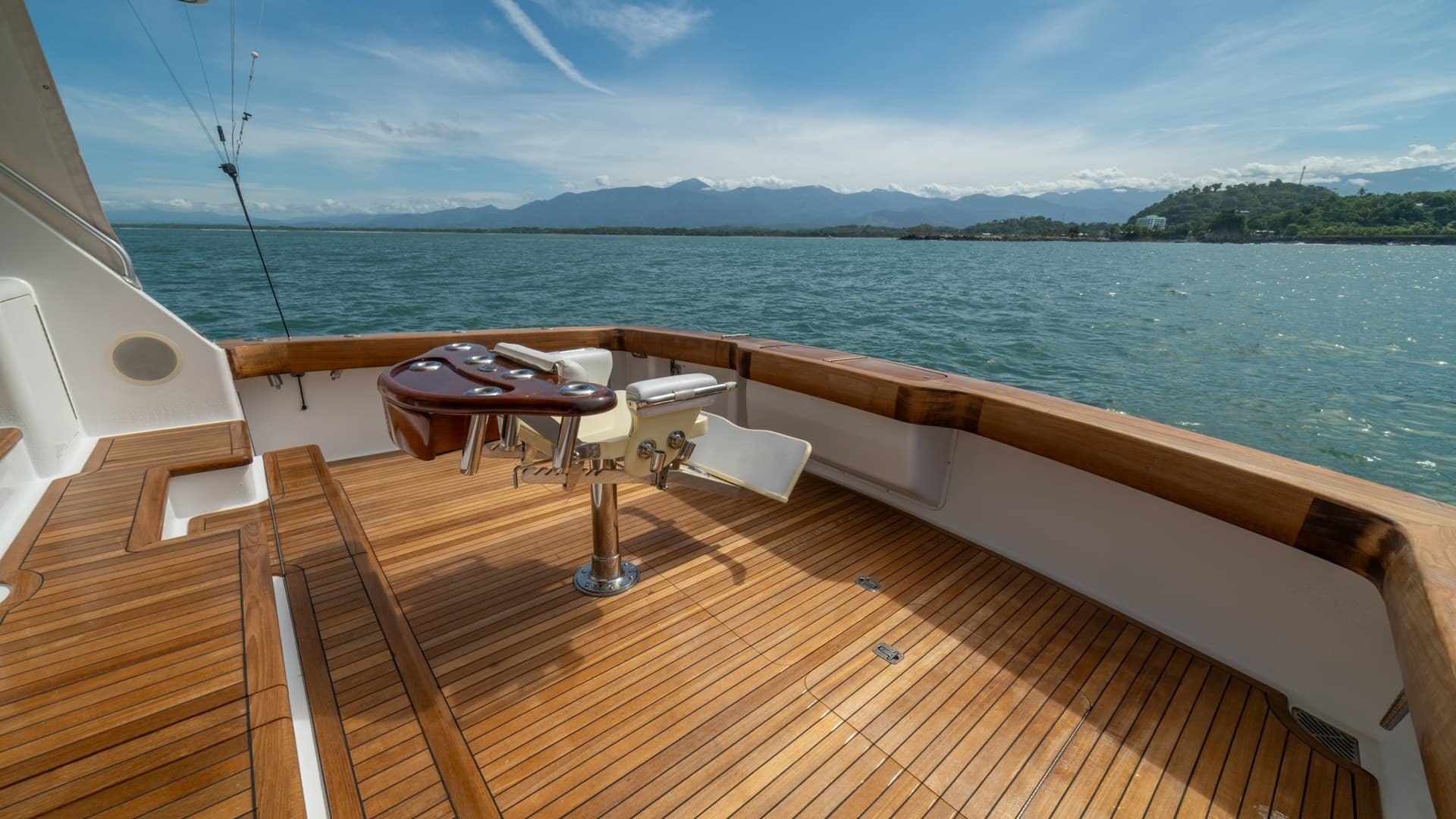 Spacious Teak Cockpit with Rod Holders 2002 Viking 61 Convertible