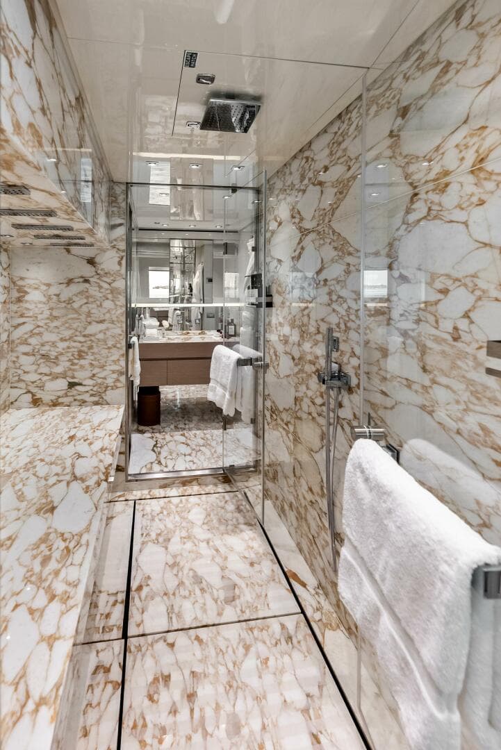 Primary Stateroom Ensuite Shower - between "his" and "hers" vanity and W.C.