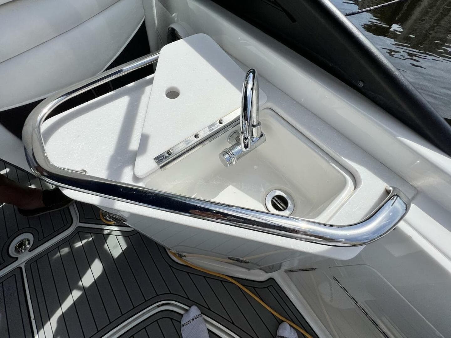 2022 Monterey M-45 boat sink with chrome faucet and safety rail.