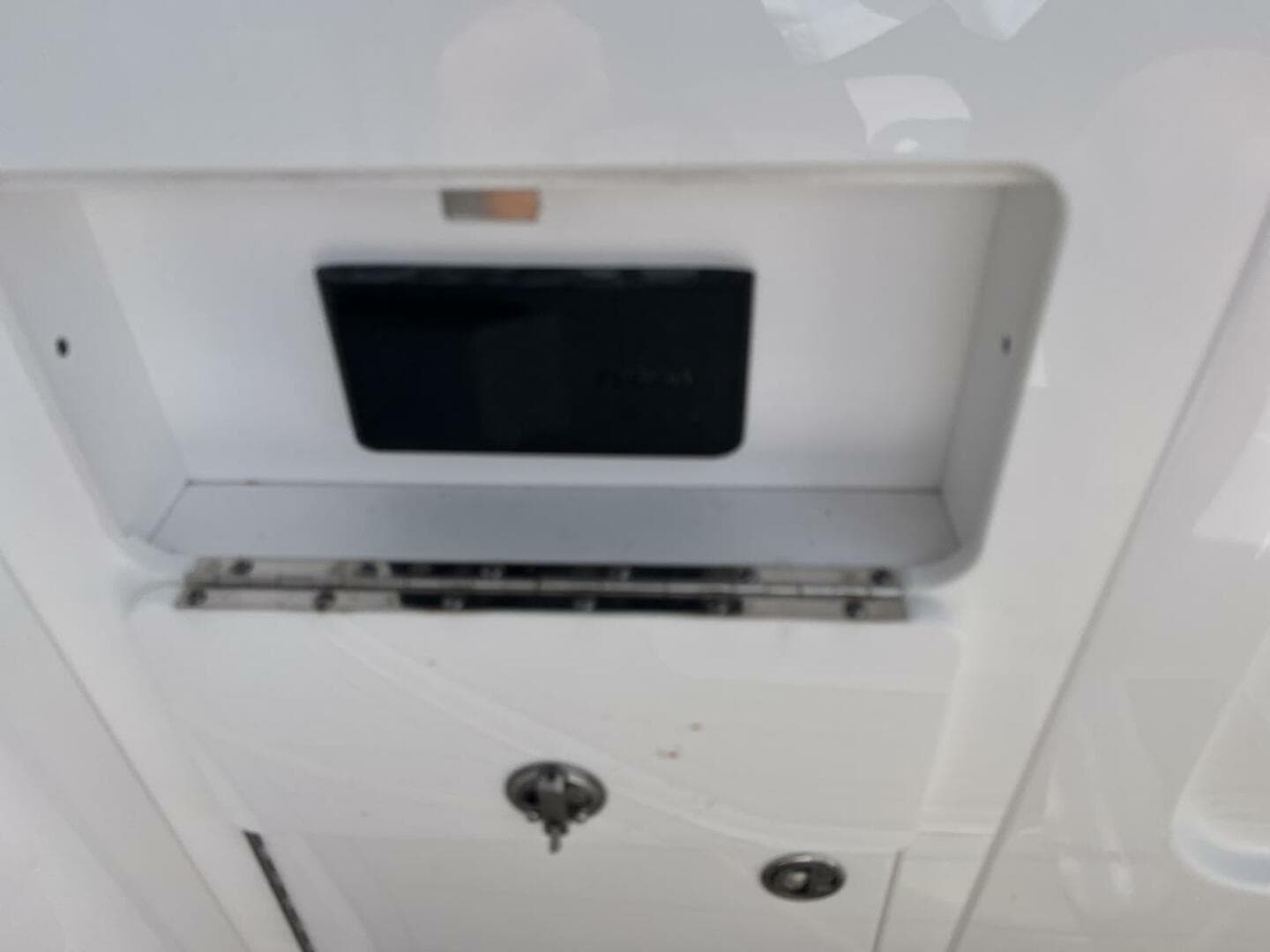 2022 Monterey M-45 boat compartment with lock and storage space.