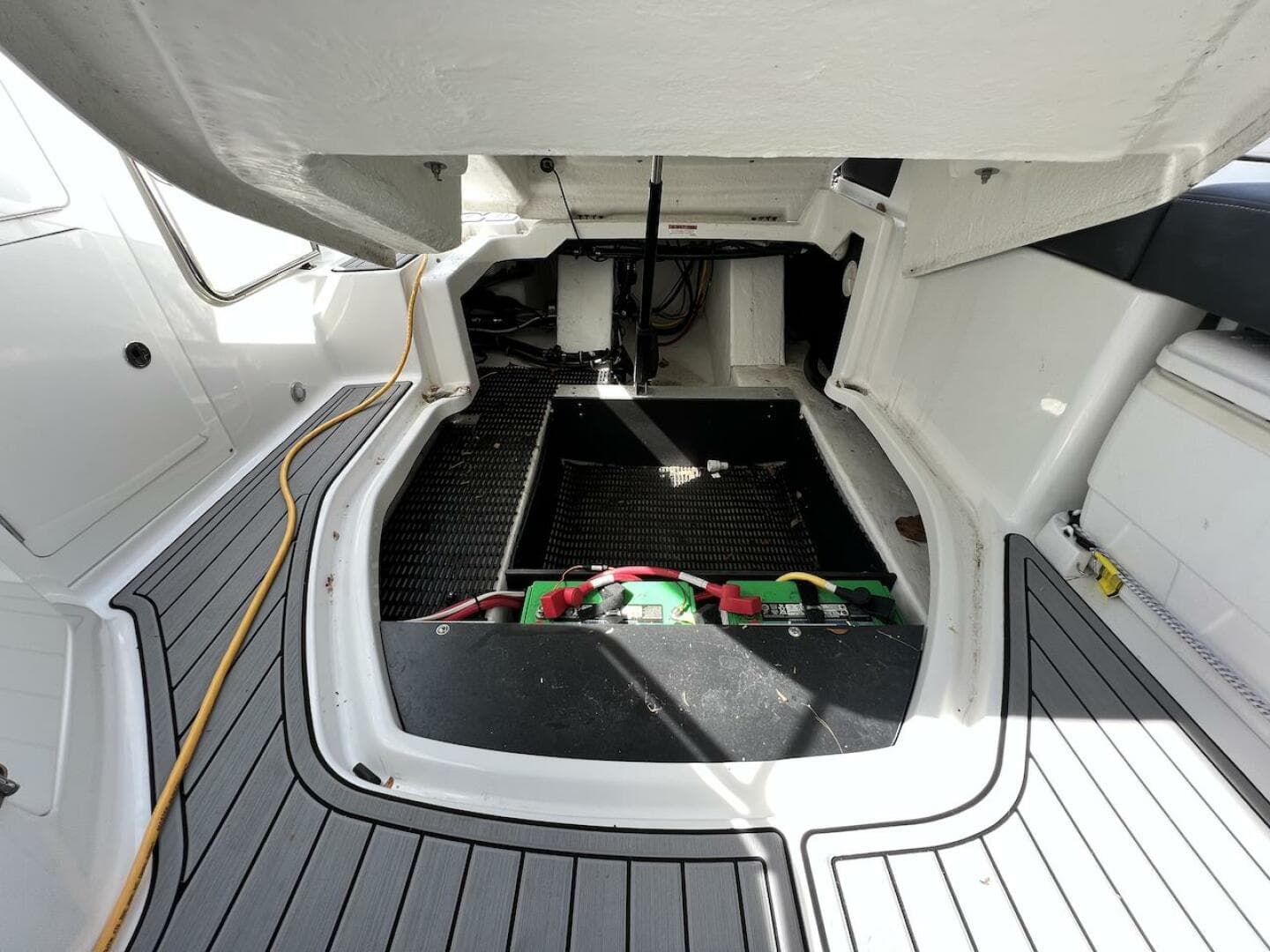 2022 Monterey M-45 boat engine compartment with open hatch and visible battery.