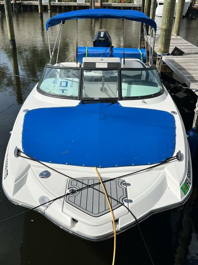 2022 Monterey M-45 boat docked with blue cover and canopy.
