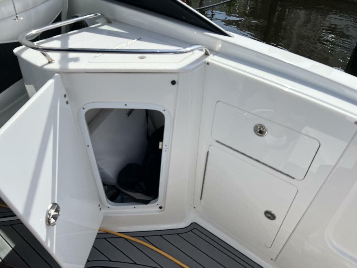 2022 Monterey M-45 boat storage compartment with open hatch and visible interior.