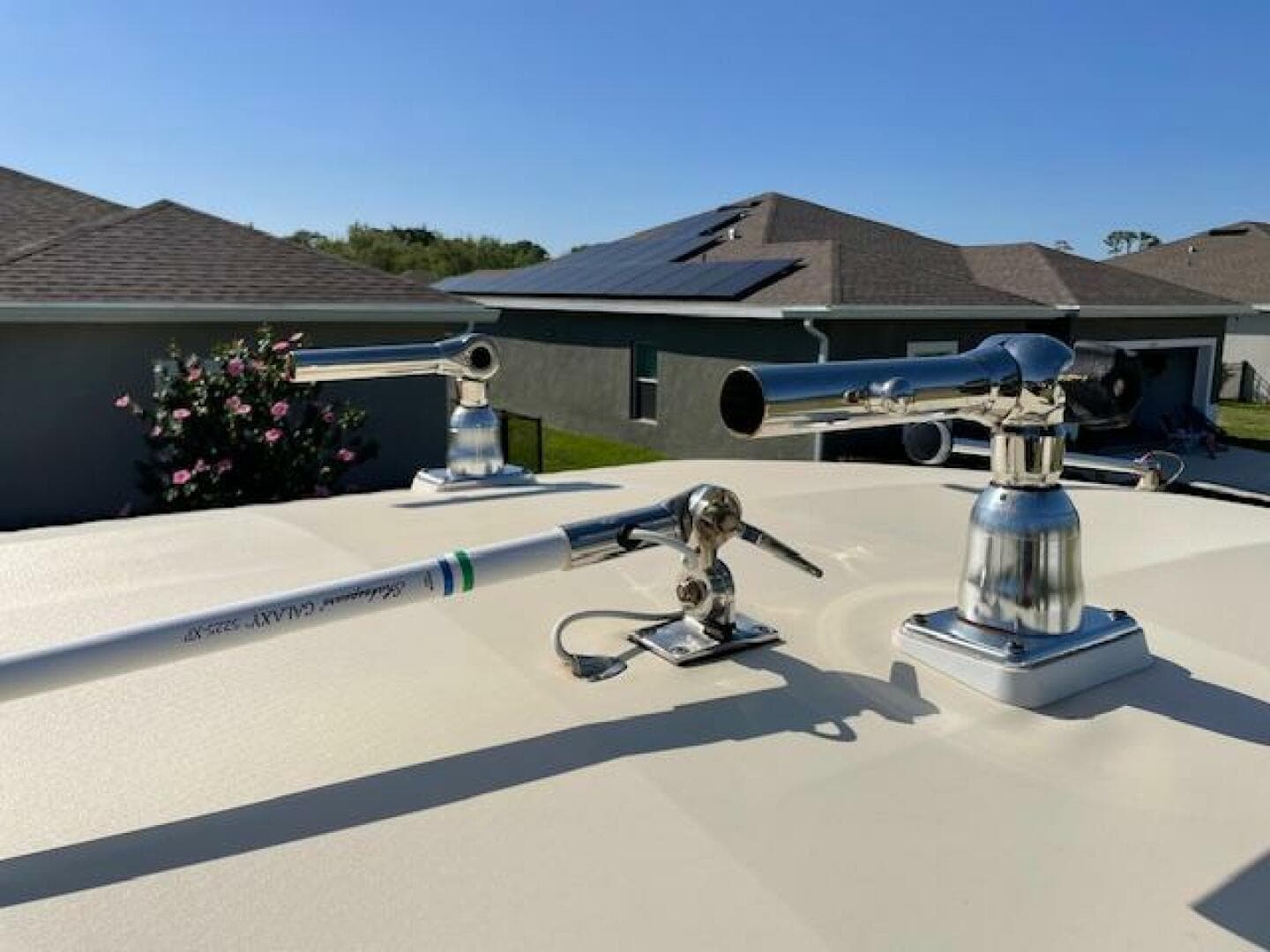 2014 Grady-White Fisherman 257 boat with mounted fishing rod holders.