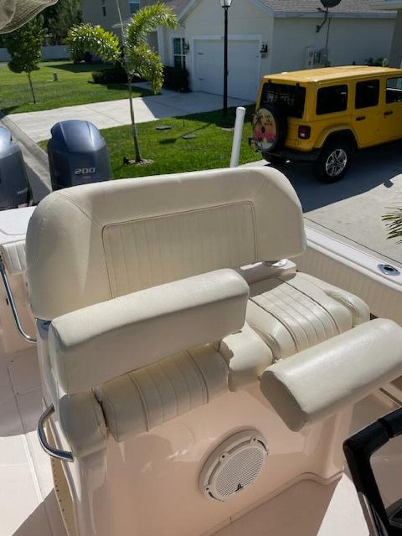2014 Grady-White Fisherman 257 boat seat and console in a residential driveway.