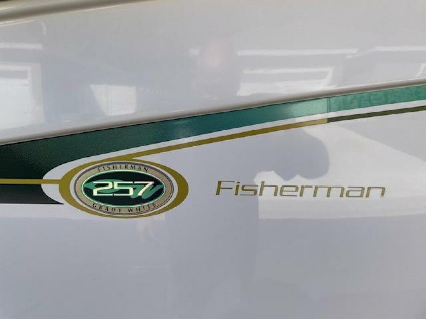 2014 Grady-White Fisherman 257 boat logo and model name on hull.