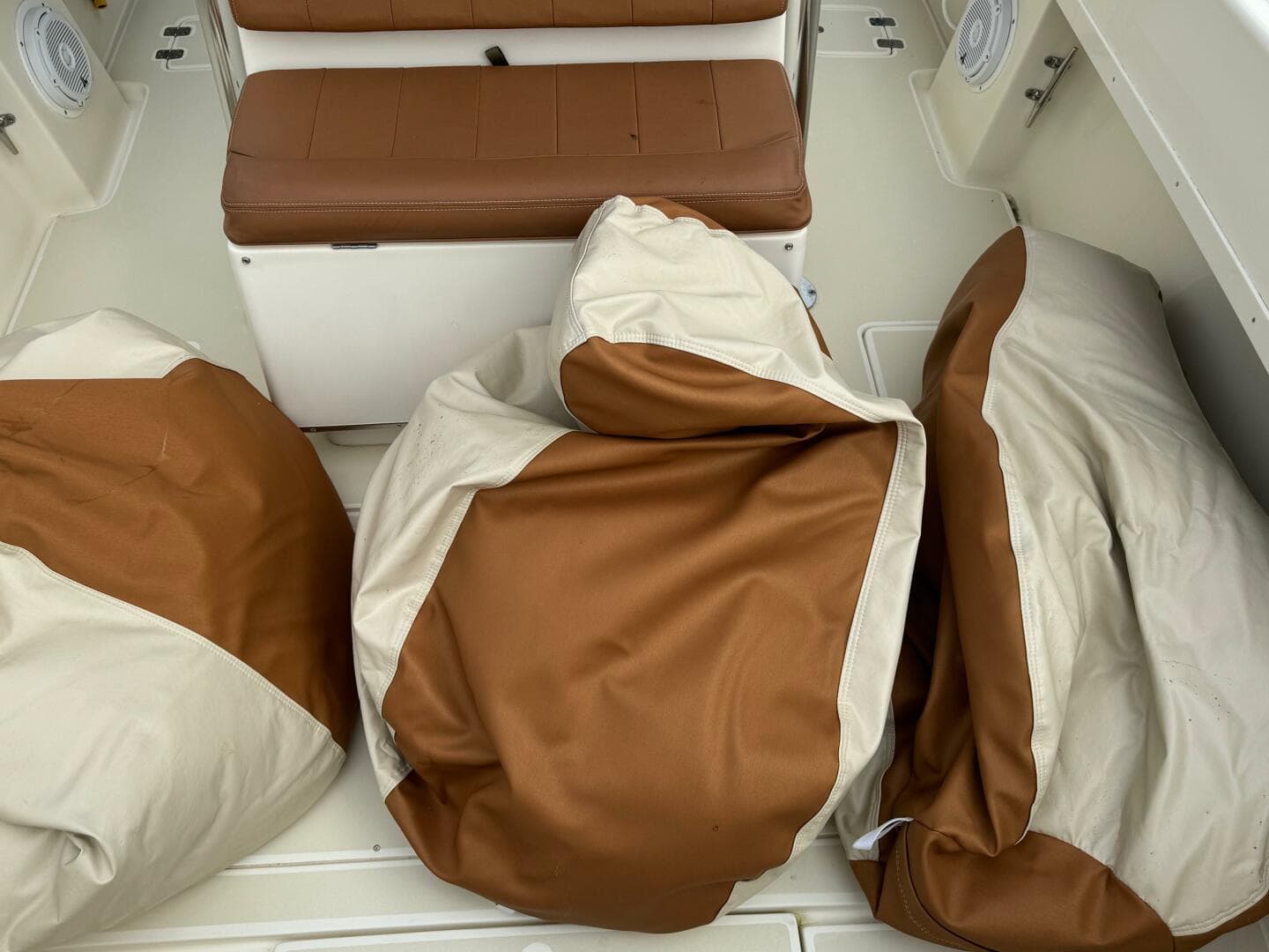 Brown and beige cushions on a 2004 Intrepid 32 Cuddy boat.