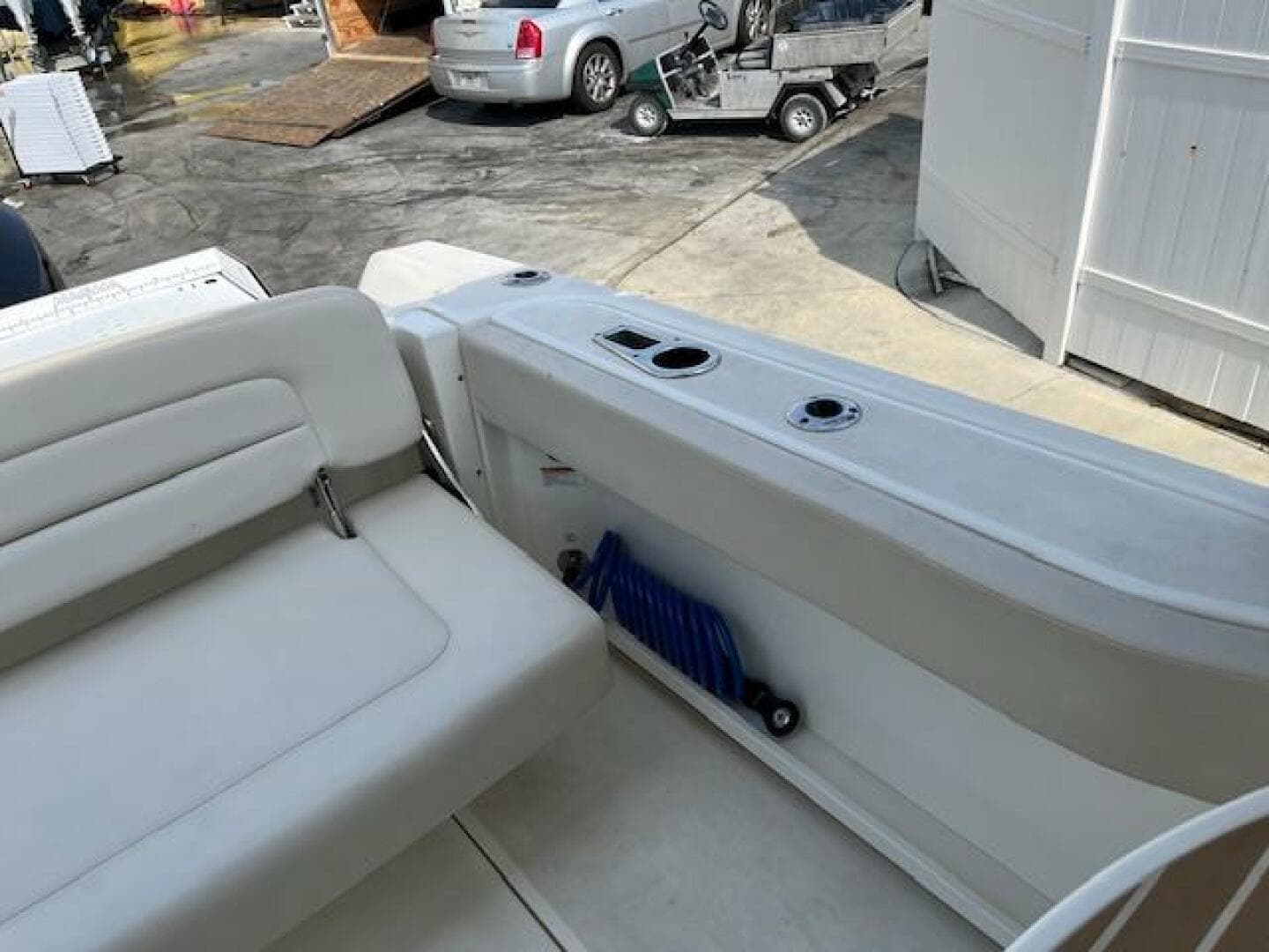 2018 Boston Whaler 270 Vantage boat interior with white seating and storage compartment.