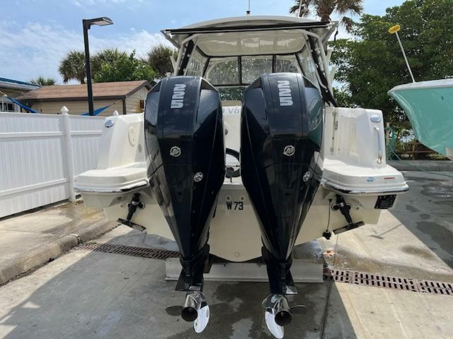 2018 Boston Whaler 270 Vantage with twin outboard engines docked.