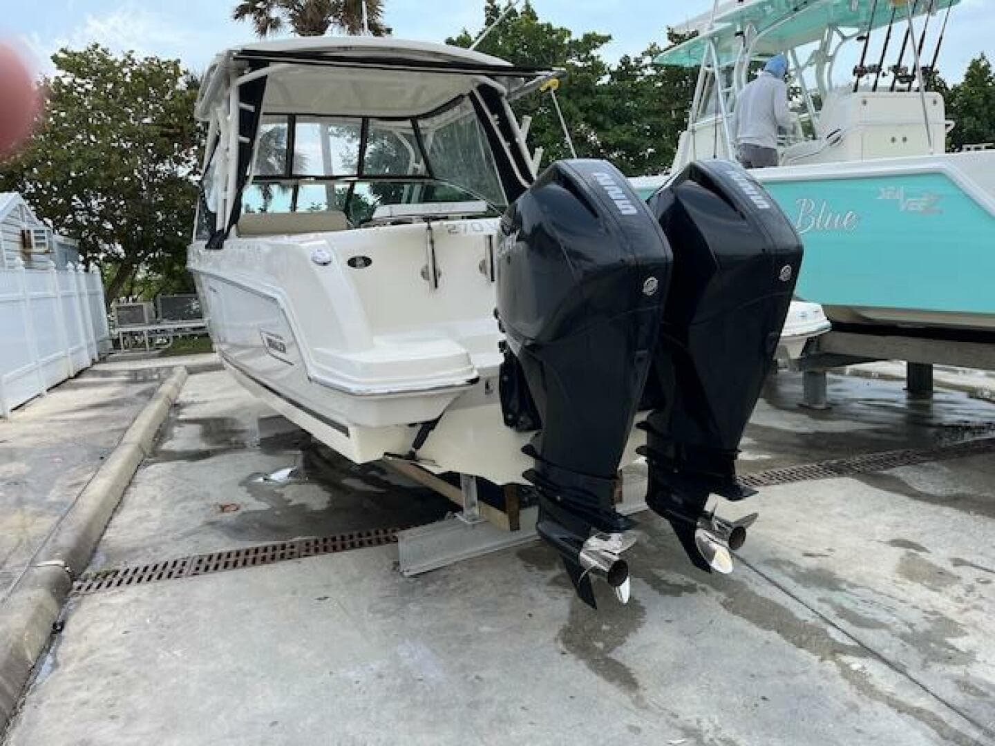 2018 Boston Whaler 270 Vantage with twin outboard engines on a trailer.