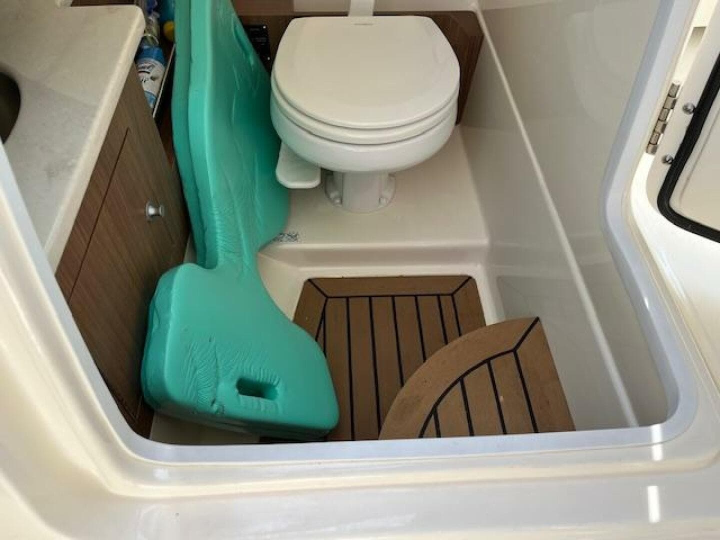 2018 Boston Whaler 270 Vantage boat bathroom with toilet and storage.
