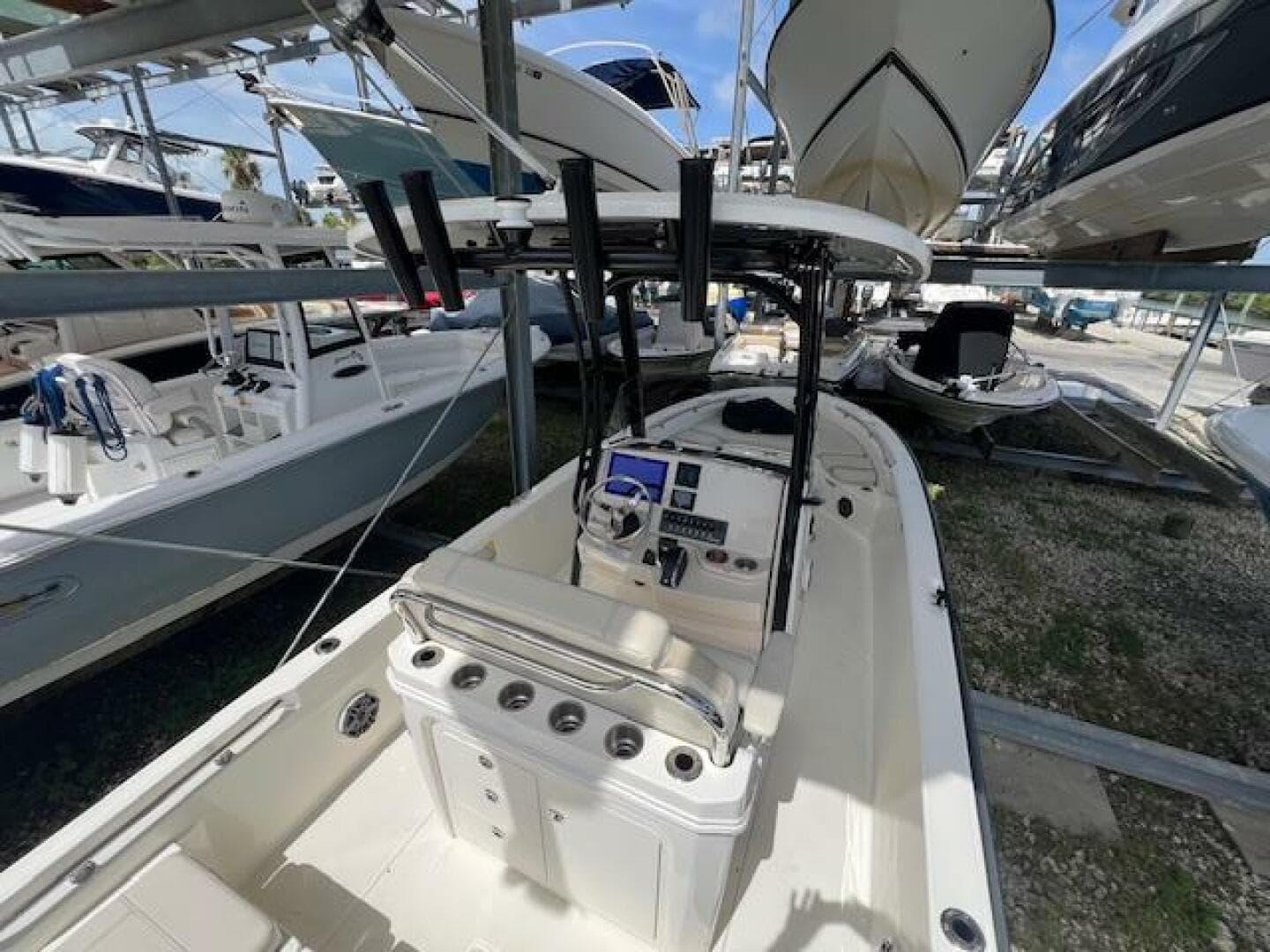 2023 Boston Whaler 250 Dauntless boat in storage, featuring a sleek console and seating area.