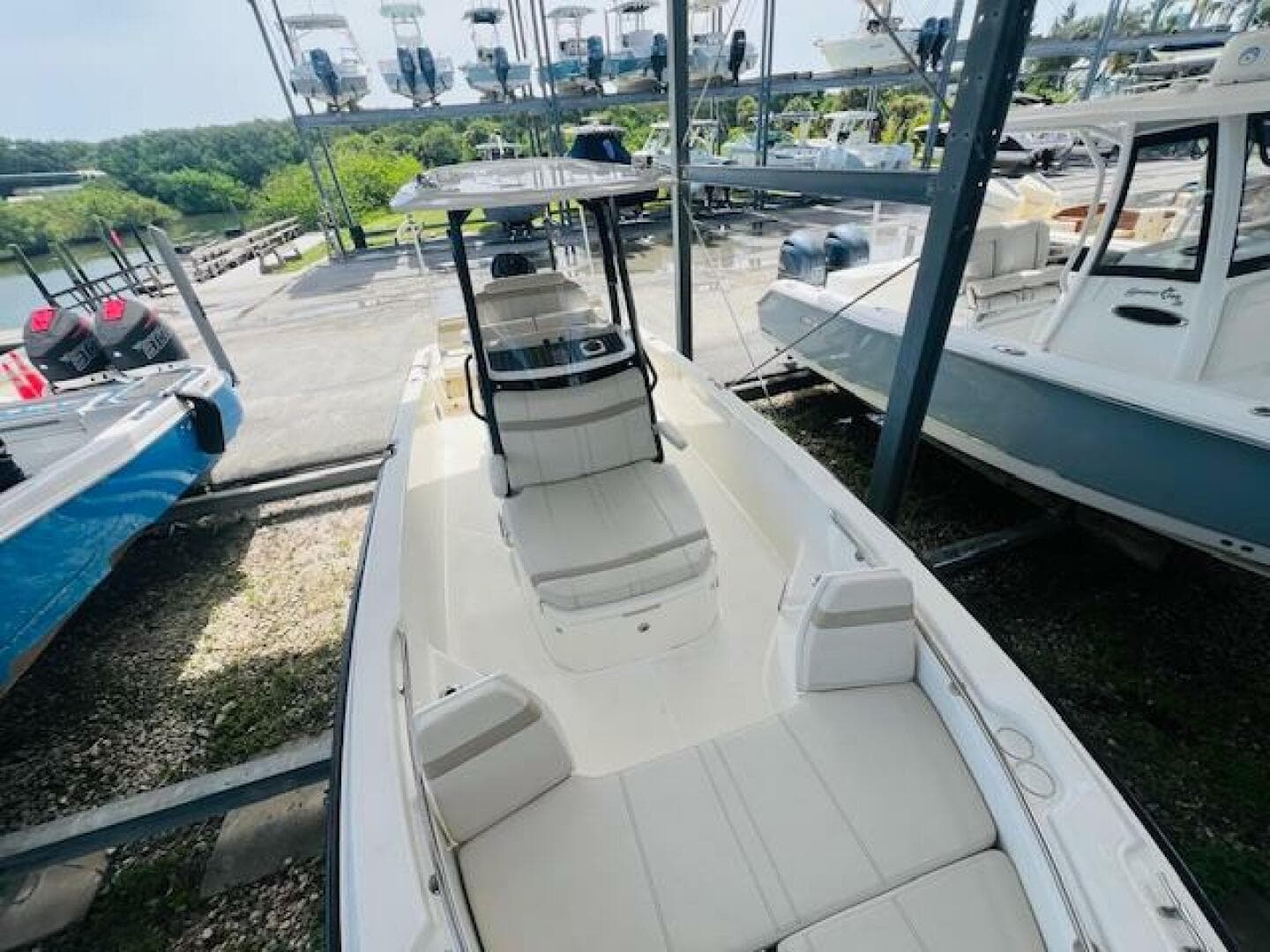 2023 Boston Whaler 250 Dauntless boat in storage, showcasing sleek design and spacious seating.