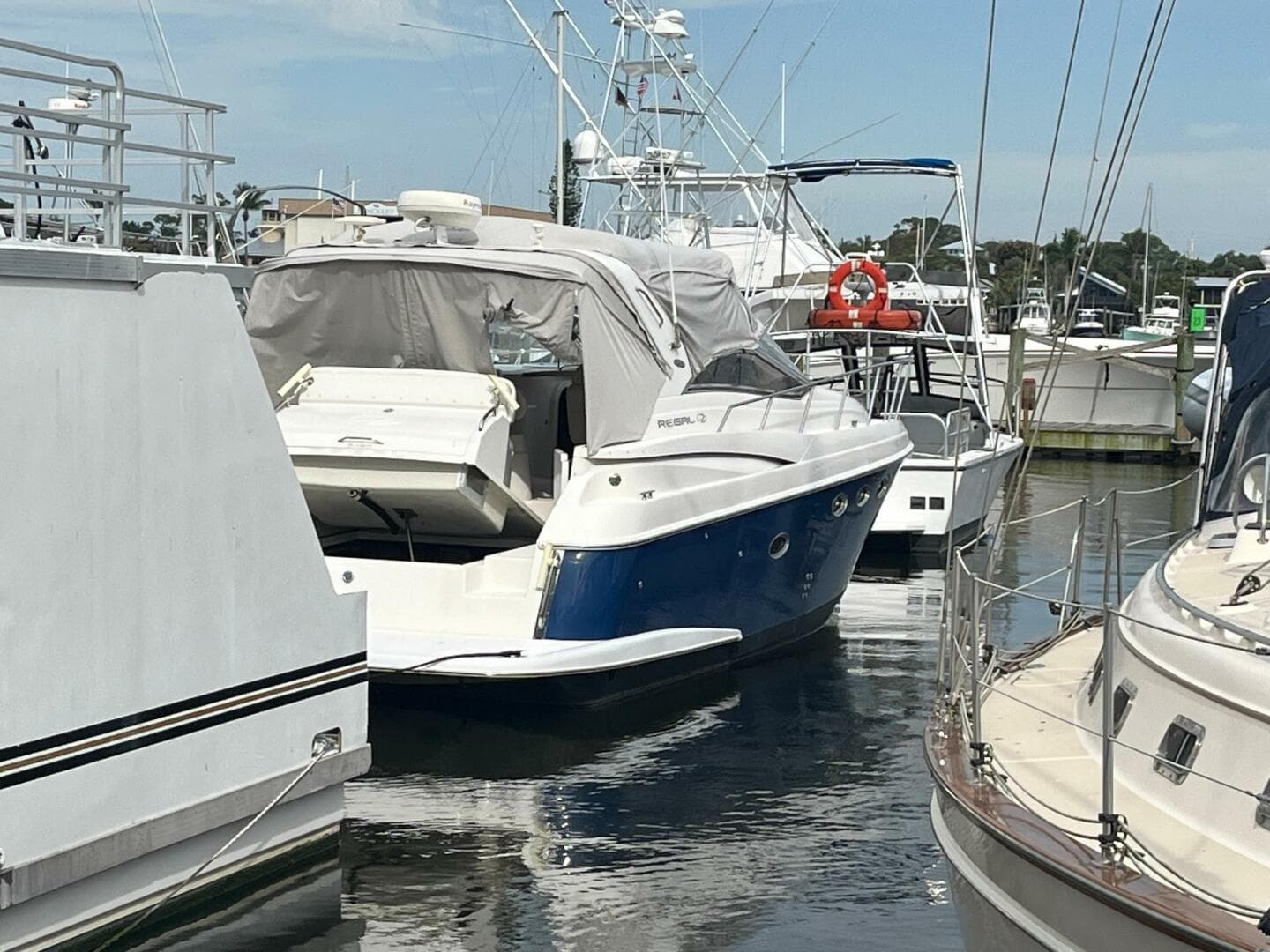 2003 Regal Commodore 3860 yacht docked at marina.