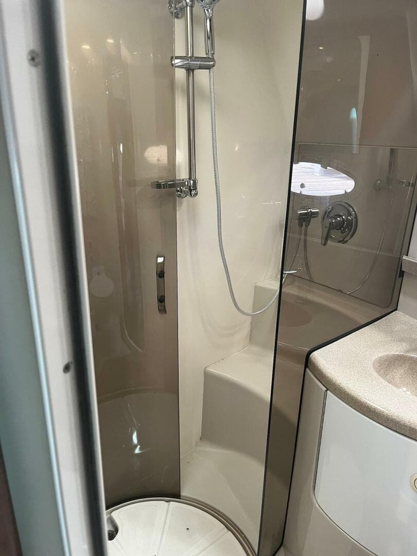2003 Regal Commodore 3860 bathroom with shower and sink.