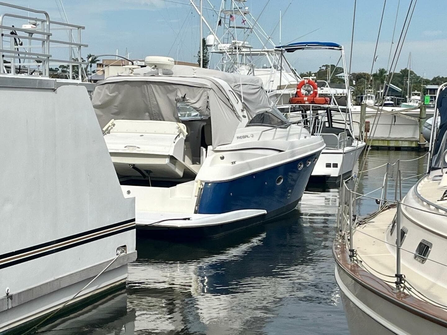 2003 Regal Commodore 3860 yacht docked at a marina.