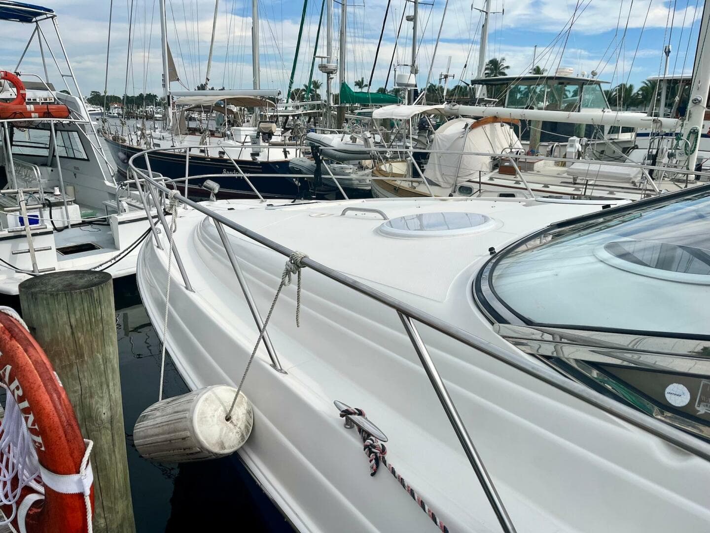 2003 Regal Commodore 3860 yacht docked at a marina with other boats.