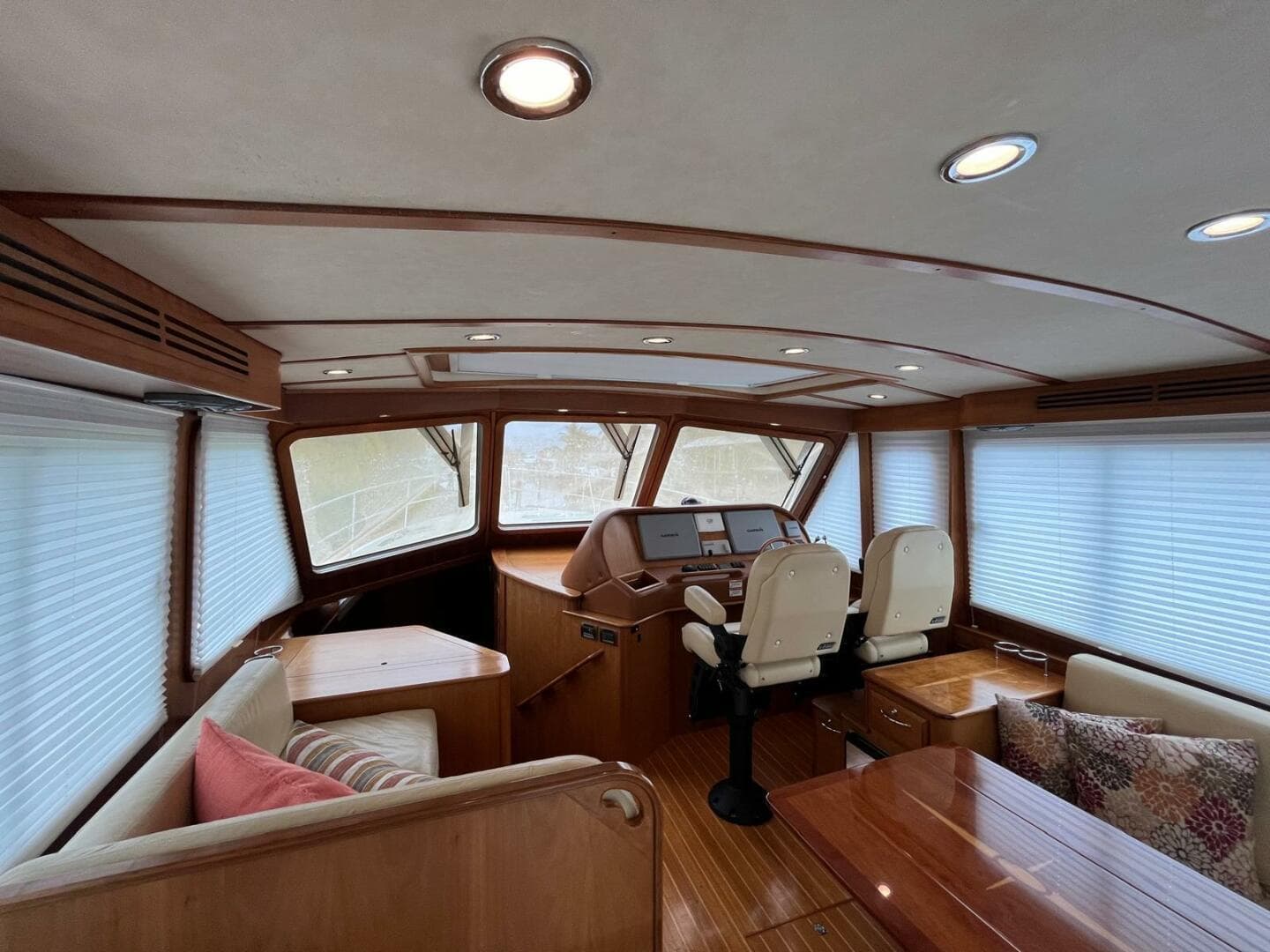 Interior of 2013 Sabre 48 Salon Express yacht with wood finish and seating area.