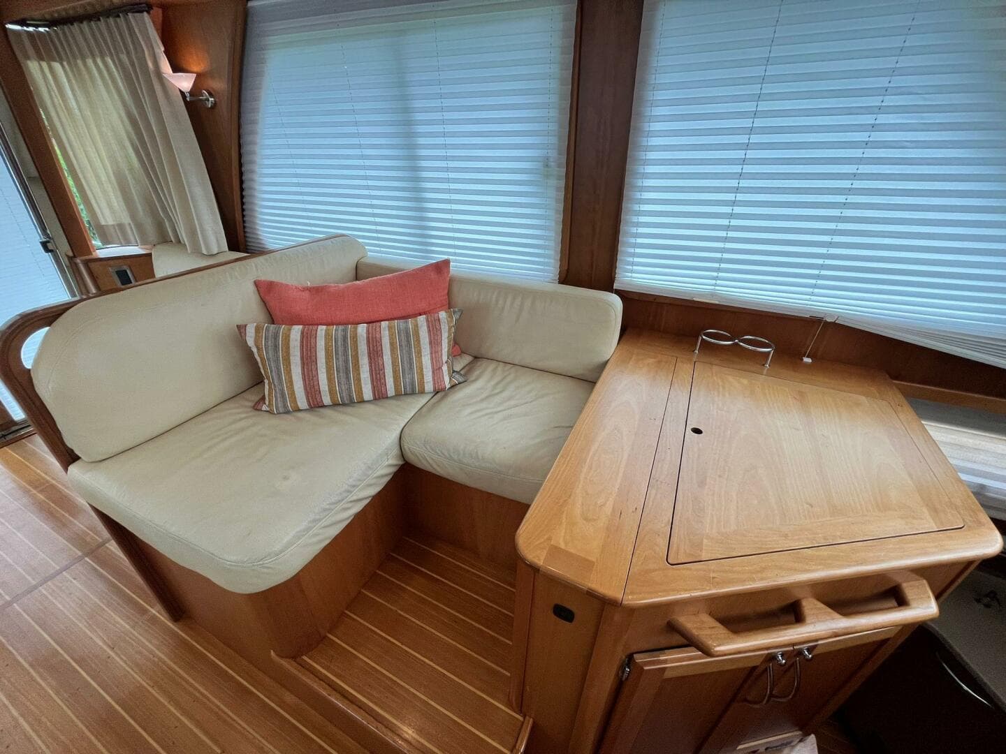 2013 Sabre 48 Salon Express interior with cozy seating and wooden table.