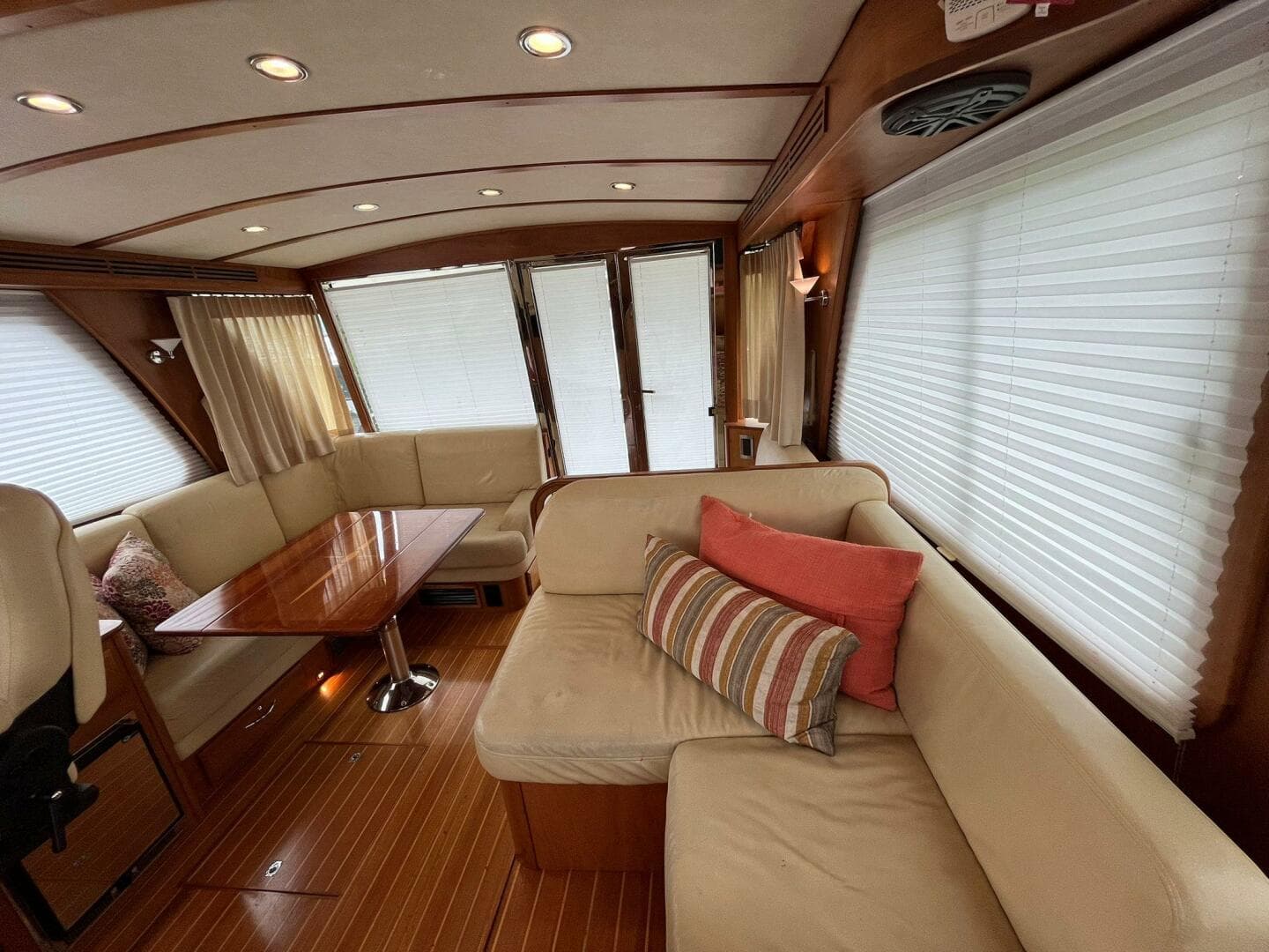 Interior of 2013 Sabre 48 Salon Express with elegant seating and wooden accents.