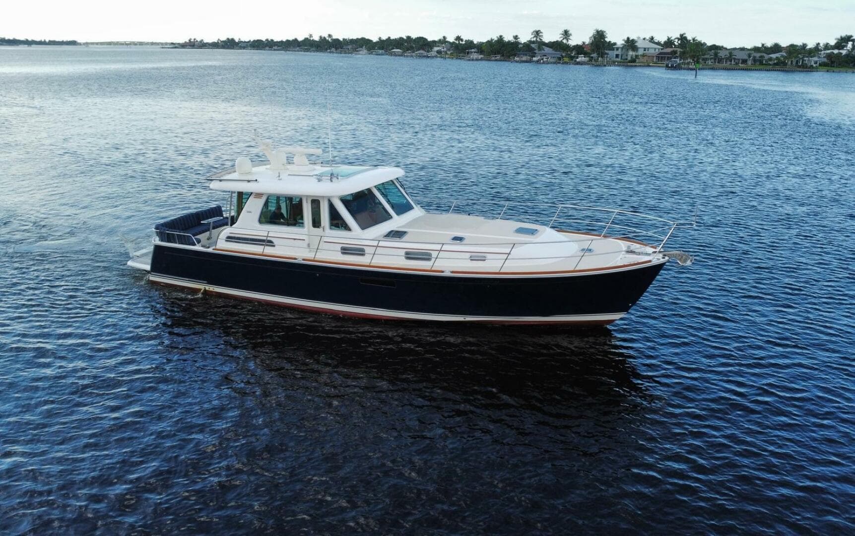 2013 Sabre 48 Salon Express yacht cruising on calm waters.