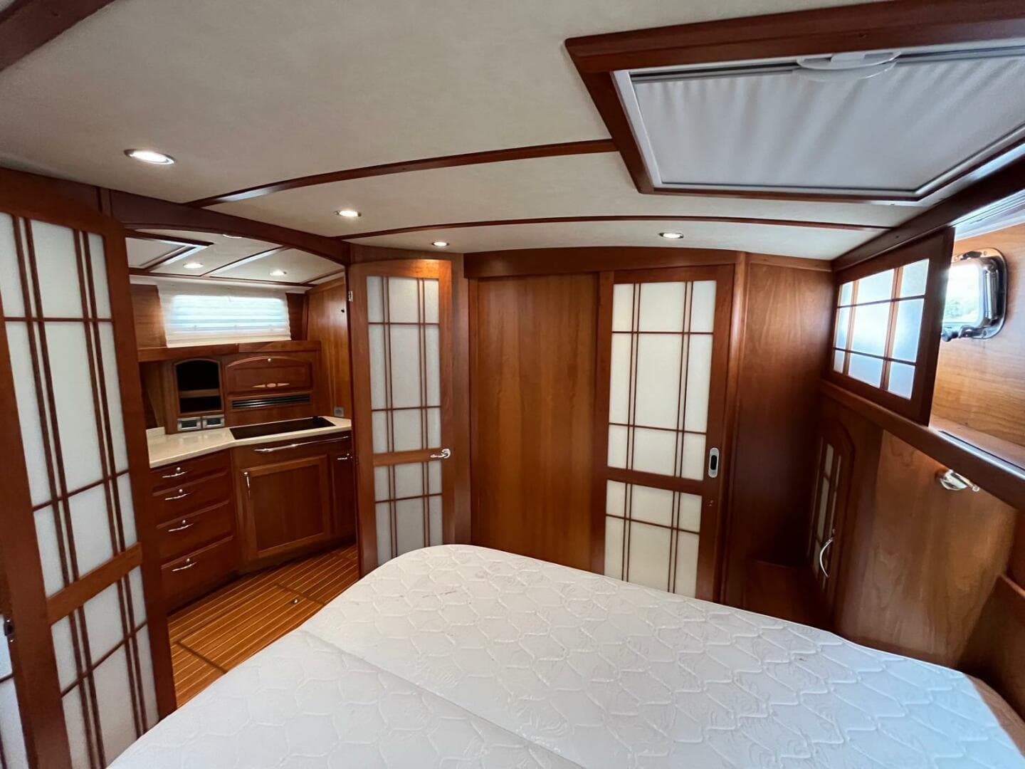 Luxurious interior of 2013 Sabre 48 Salon Express yacht with wood paneling and modern amenities.