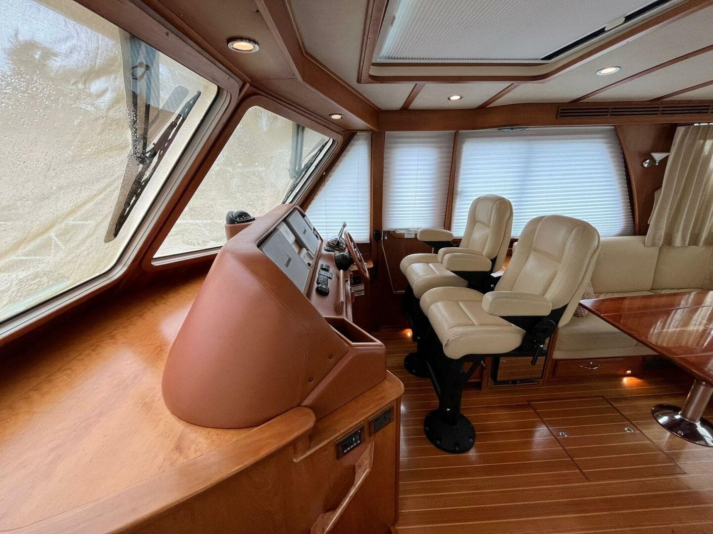 Interior of 2013 Sabre 48 Salon Express yacht with leather seats and wooden finishes.