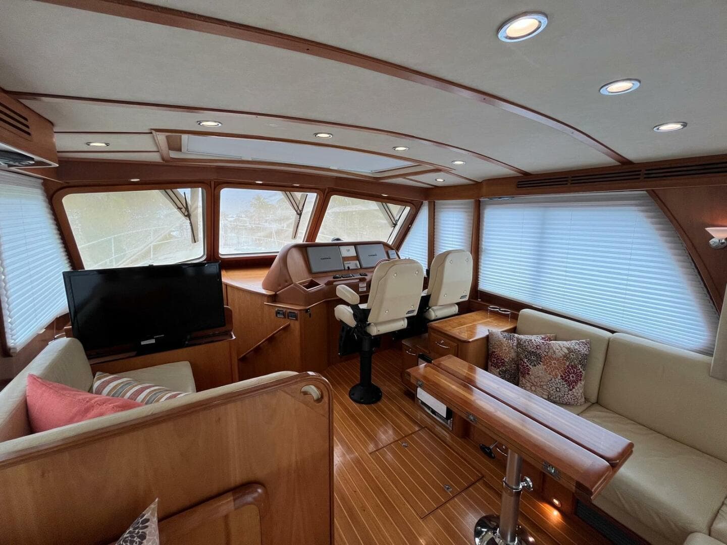 Luxurious interior of 2013 Sabre 48 Salon Express yacht with wood finish and seating.