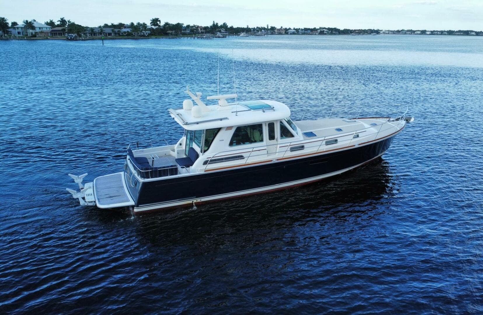 2013 Sabre 48 Salon Express yacht on calm blue water.