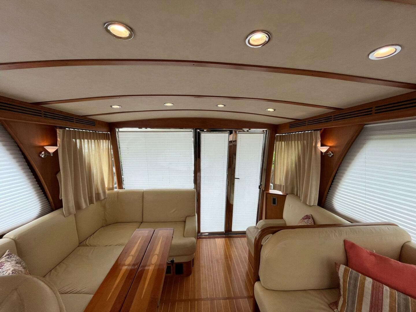 Luxurious interior of 2013 Sabre 48 Salon Express yacht with elegant seating and wood accents.