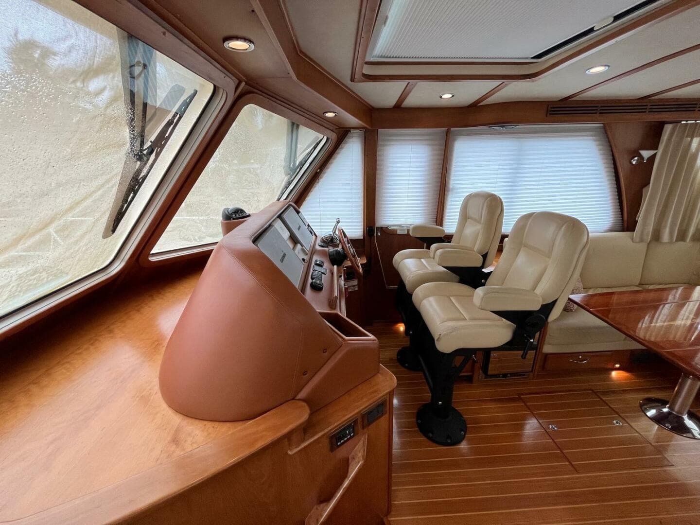 Interior of 2013 Sabre 48 Salon Express yacht with leather seats and wooden flooring.