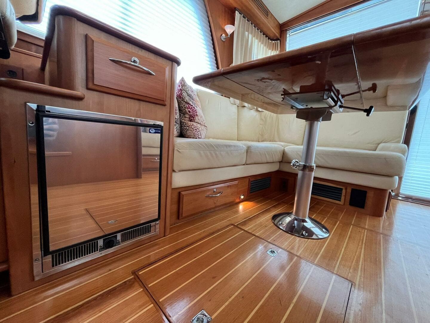 2013 Sabre 48 Salon Express interior with wood flooring and cozy seating area.