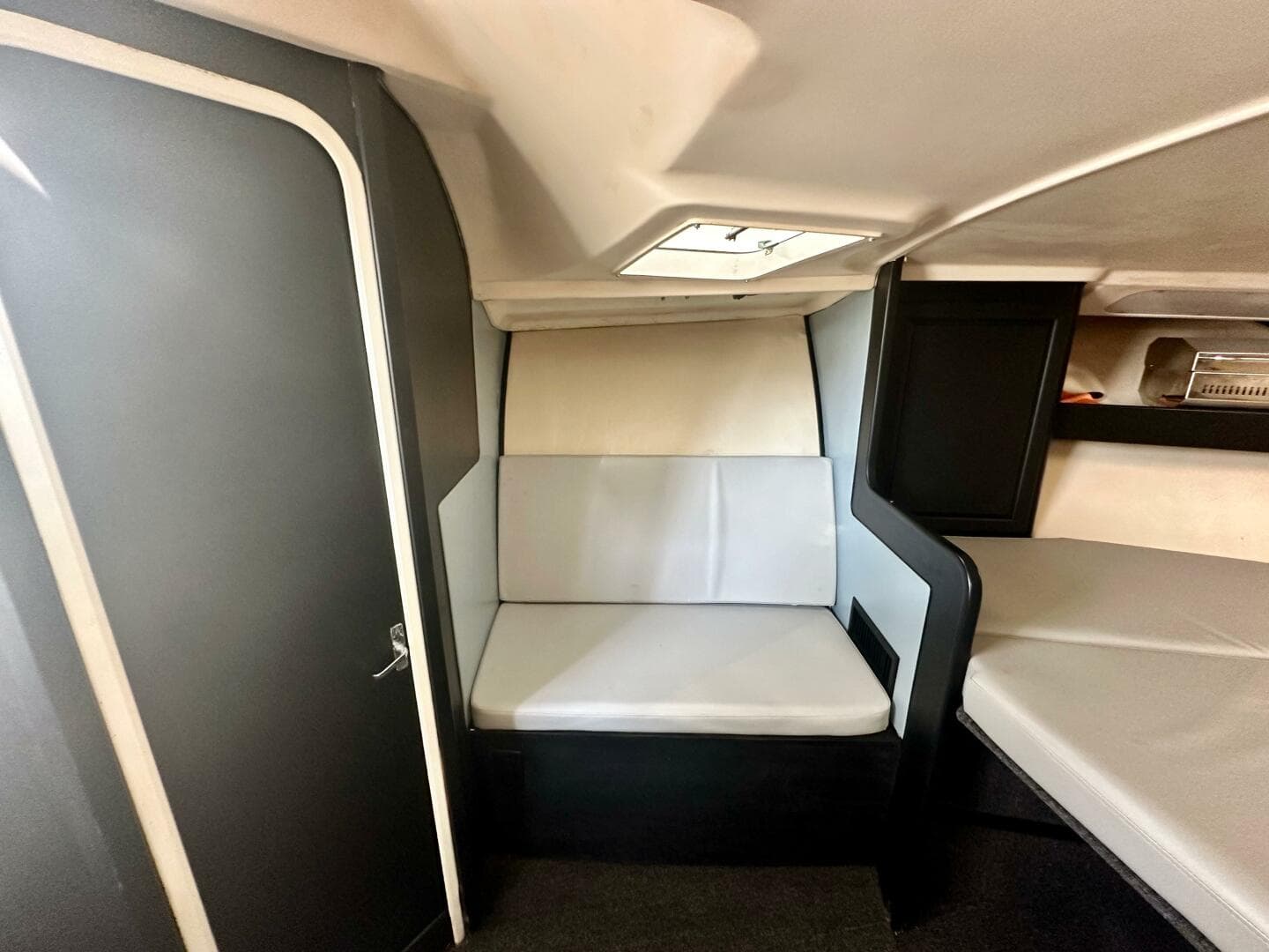 Interior cabin of 2000 Luhrs Tournament 320 Open boat with seating and storage.