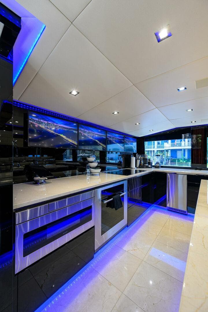 Modern kitchen interior on 1997 Broward 108 Raised Pilothouse yacht.