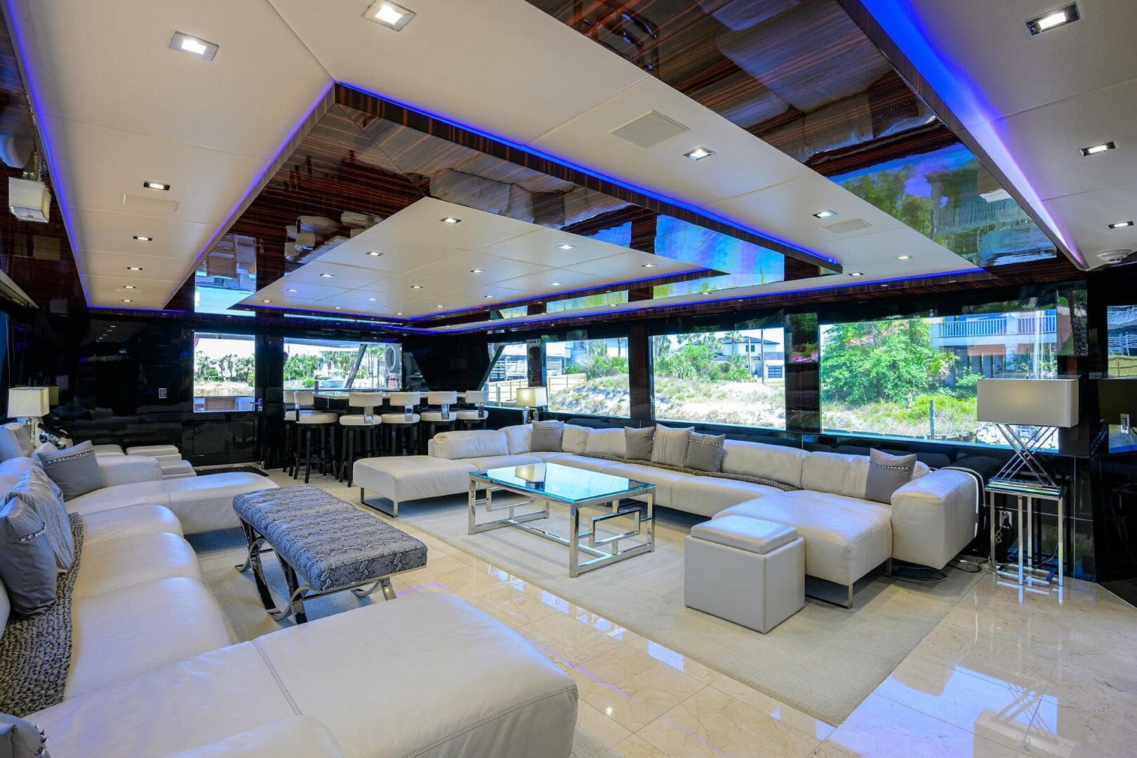 Luxurious interior of 1997 Broward 108 Raised Pilothouse yacht with modern furnishings.