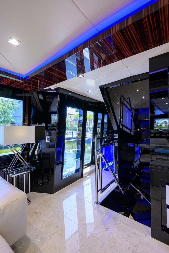 Luxurious interior of 1997 Broward 108 Raised Pilothouse yacht with modern decor.