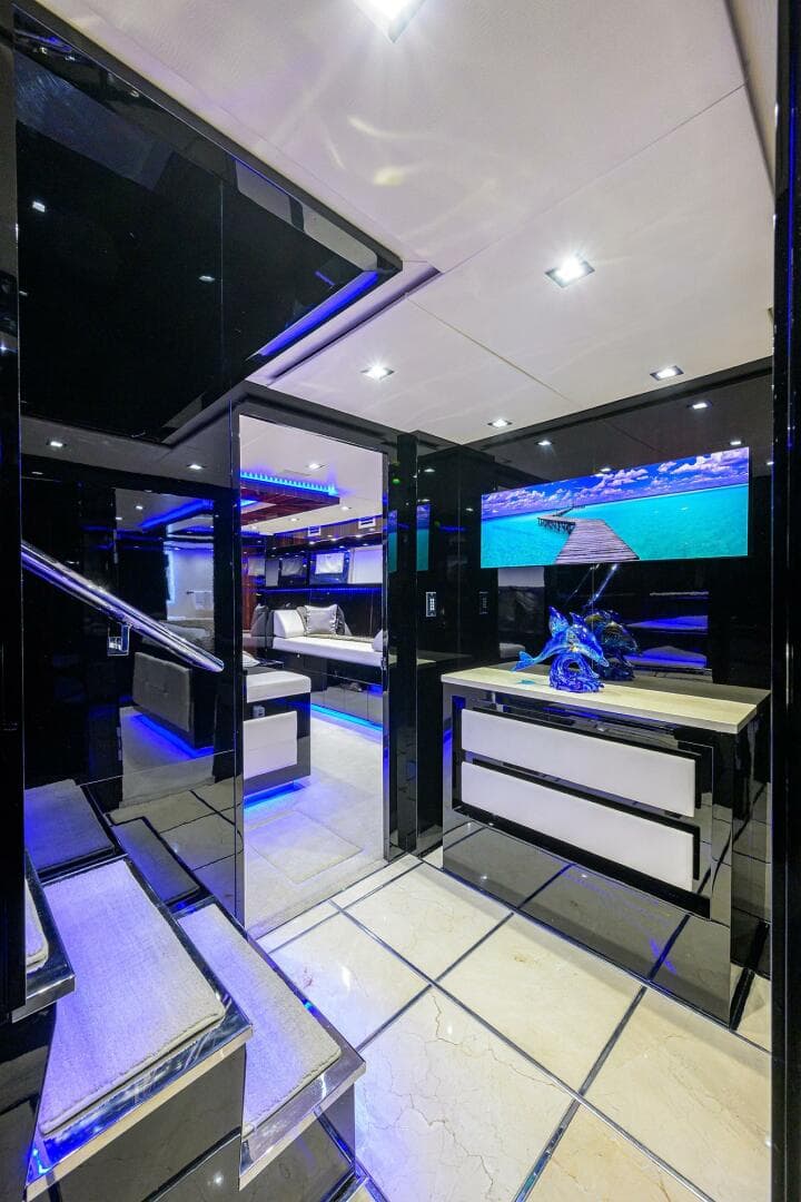 Luxurious interior of 1997 Broward 108 Raised Pilothouse yacht with modern decor and LED lighting.