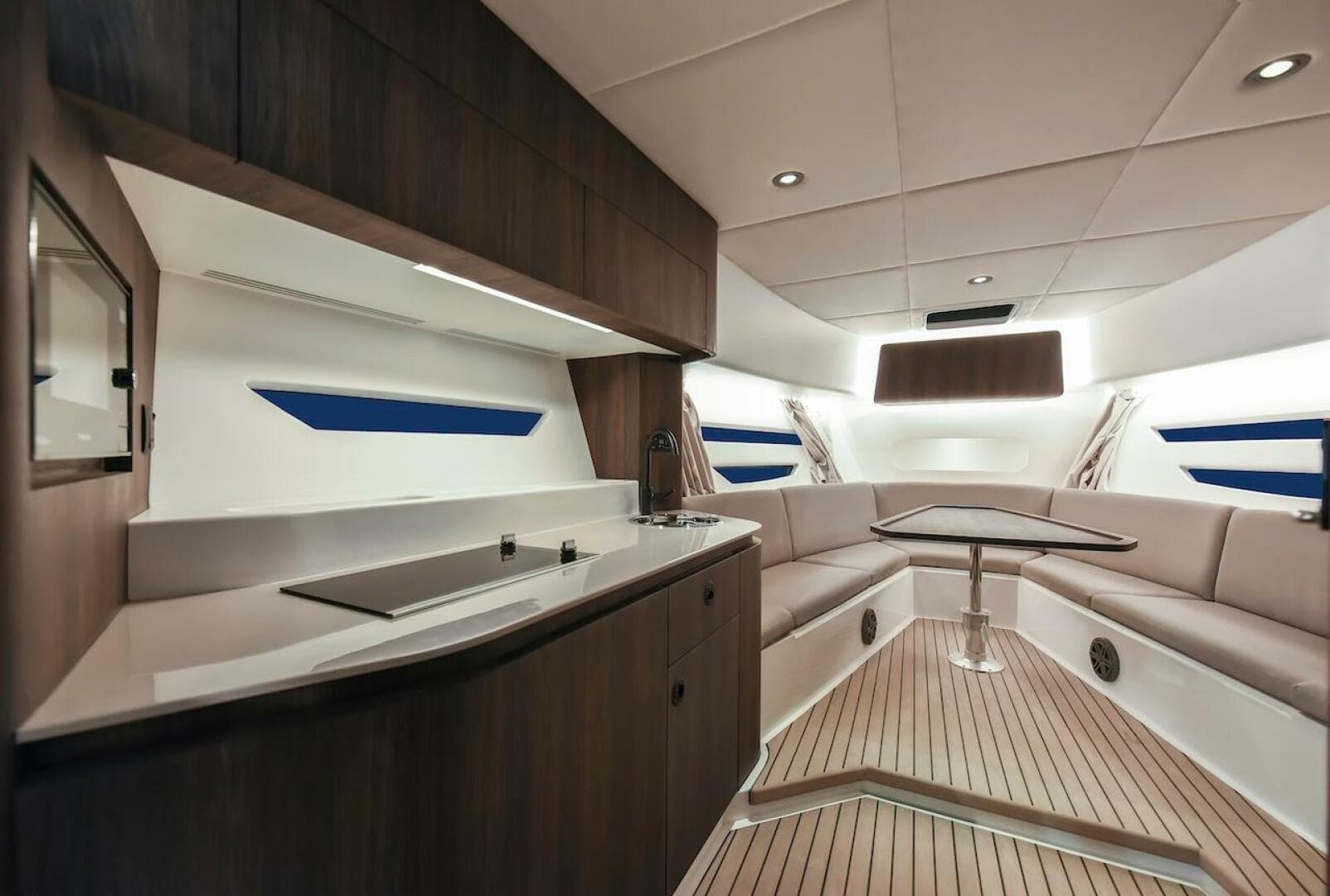 Luxurious interior of 2024 Oryx 379 yacht with modern kitchen and seating area.