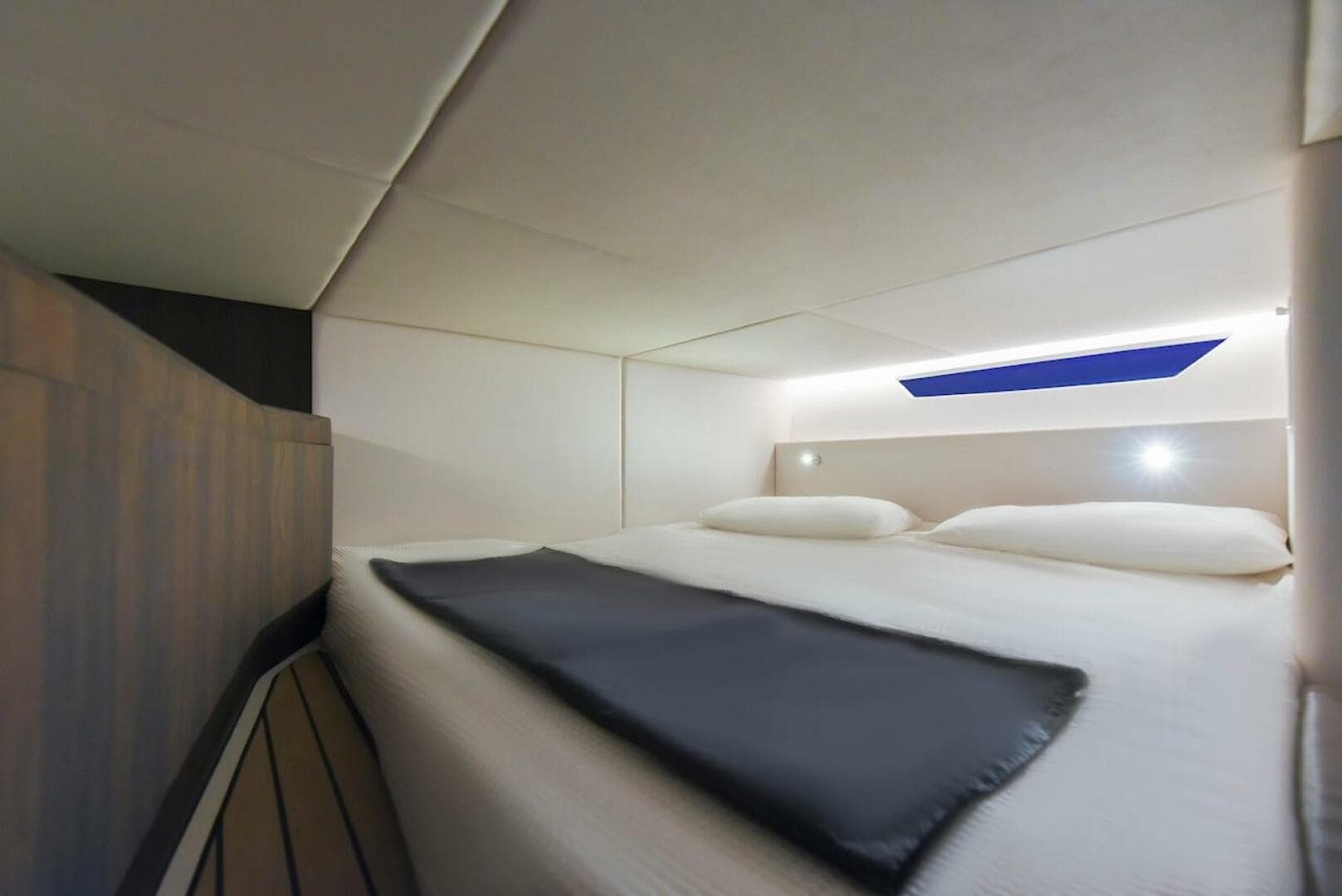 Luxurious cabin interior of 2024 Oryx 379 yacht with modern bedding and ambient lighting.
