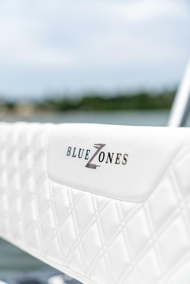 Close-up of BlueZones Boatworks 2025 16' Flats boat seat with logo.