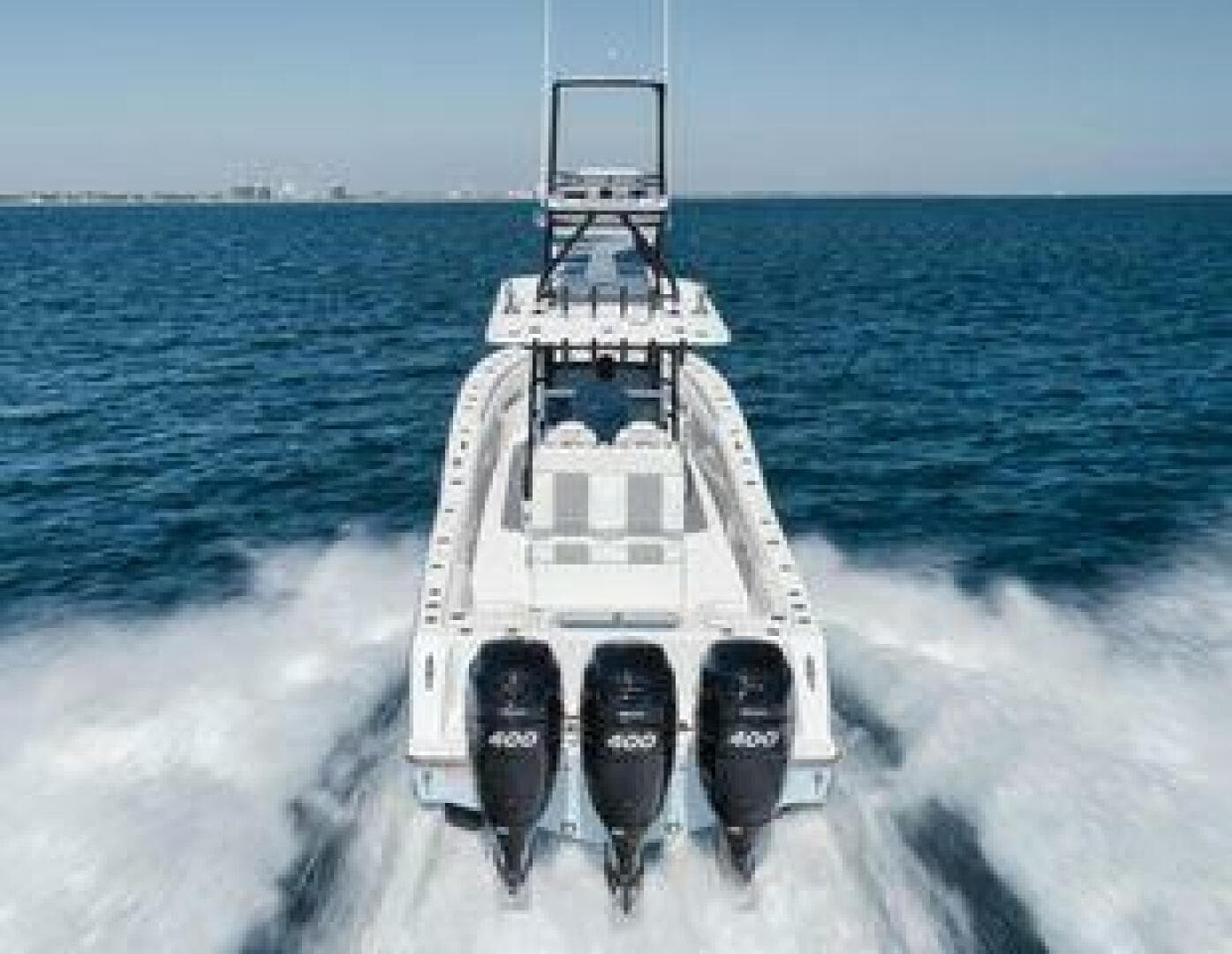 2022 Invincible 36 Open Fisherman boat speeding on open water.