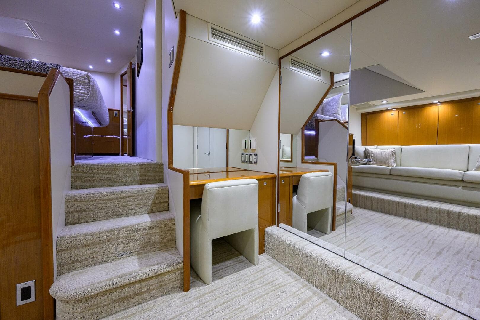 Luxurious interior of a 2004 Viking 65 Enclosed Bridge yacht with tower, featuring a cozy seating area.