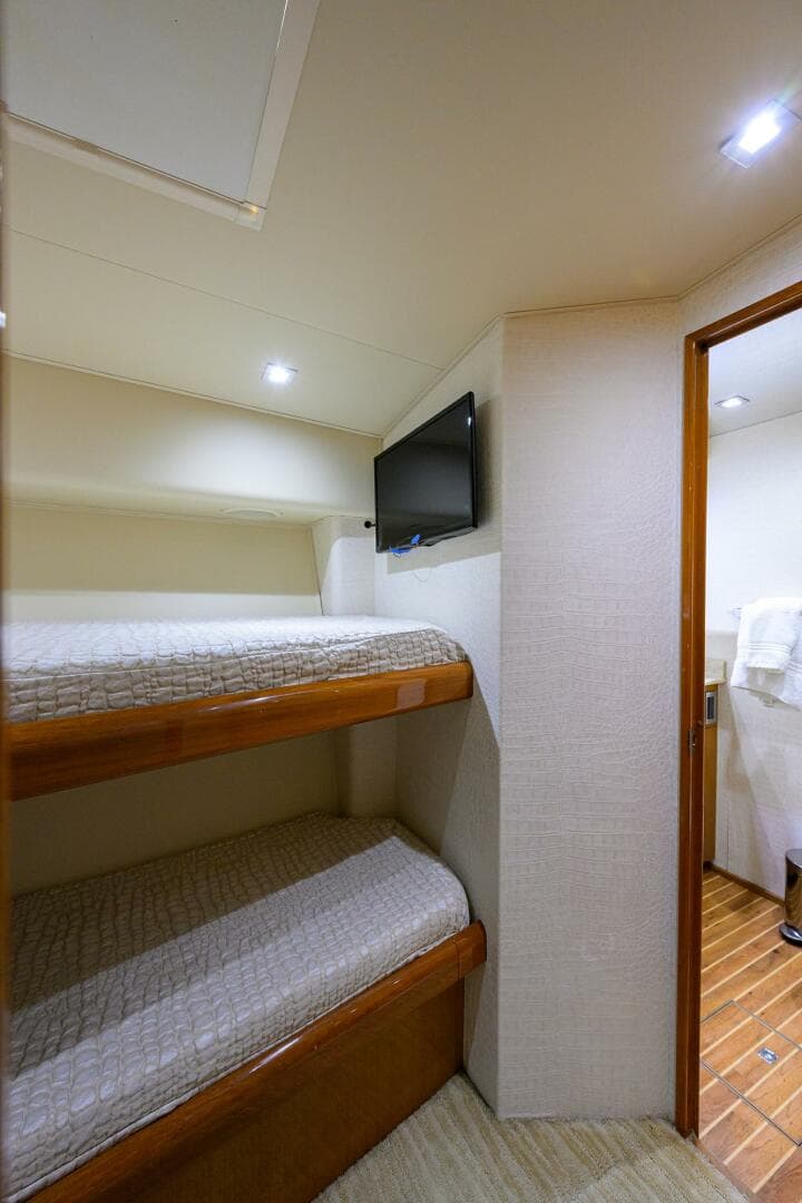 2004 Viking 65 Enclosed Bridge w/Tower cabin with bunk beds and TV