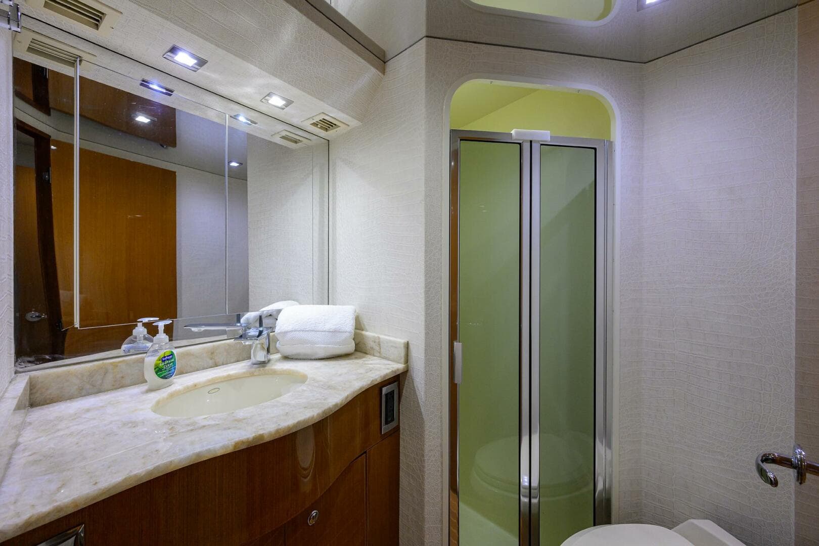 Luxurious bathroom on a 2004 Viking 65 Enclosed Bridge yacht with modern fixtures.