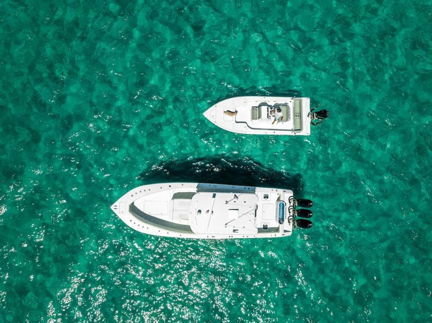 Aerial view of 2025 Billfish 39 Center Console boat on turquoise water.