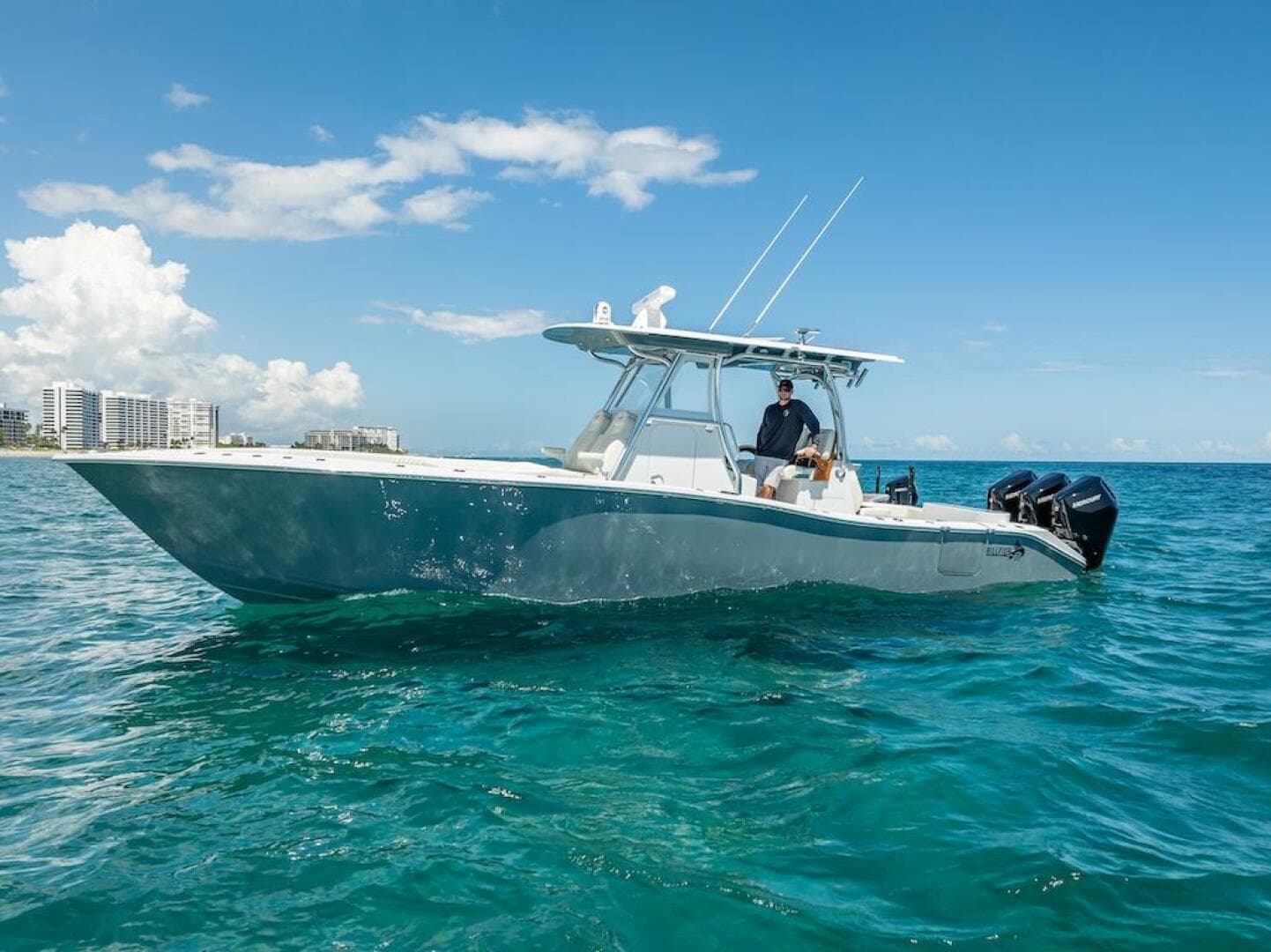 2025 Billfish 39 Center Console boat on clear blue water.
