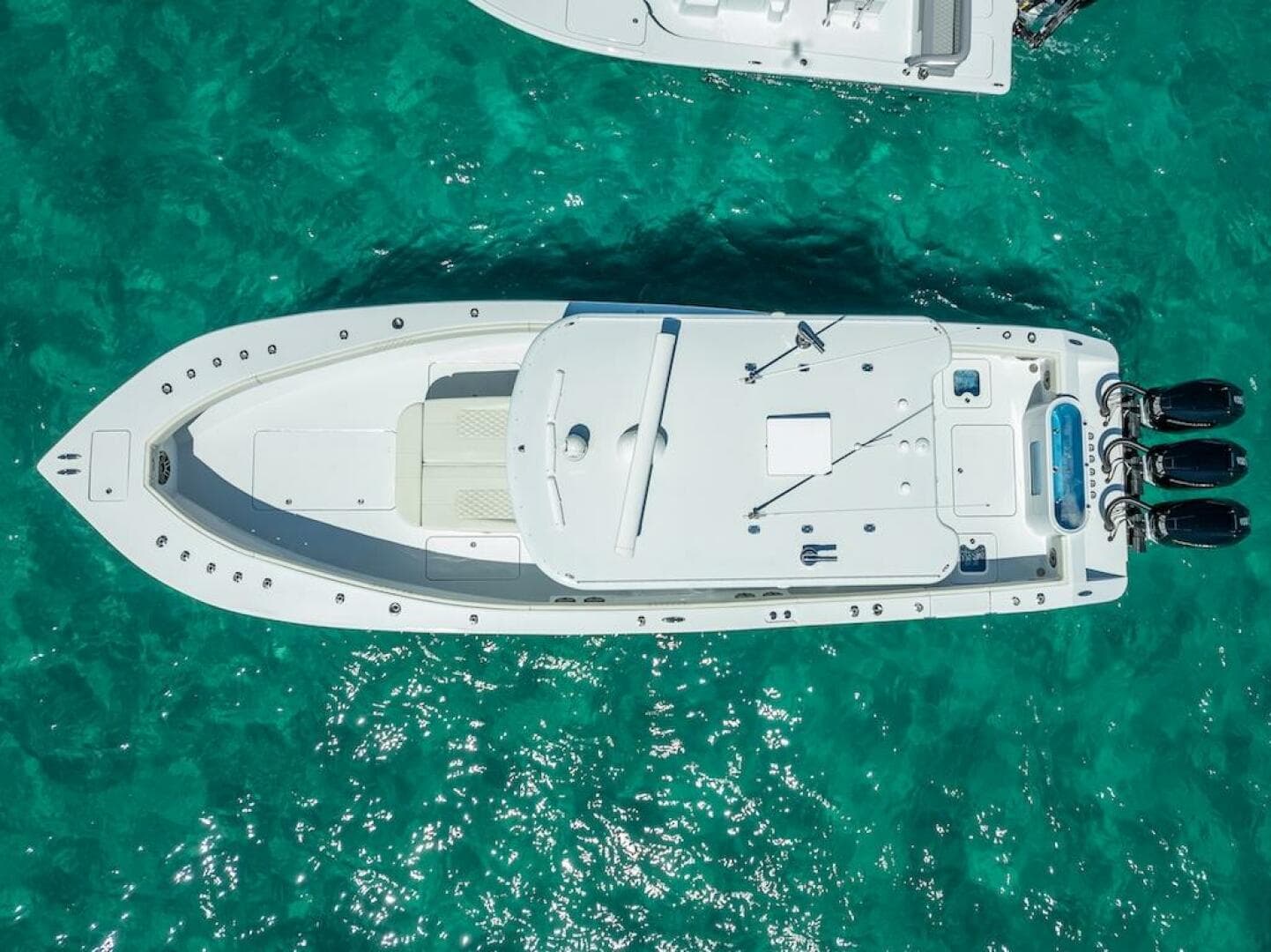 Aerial view of 2025 Billfish 39 Center Console boat on turquoise water.