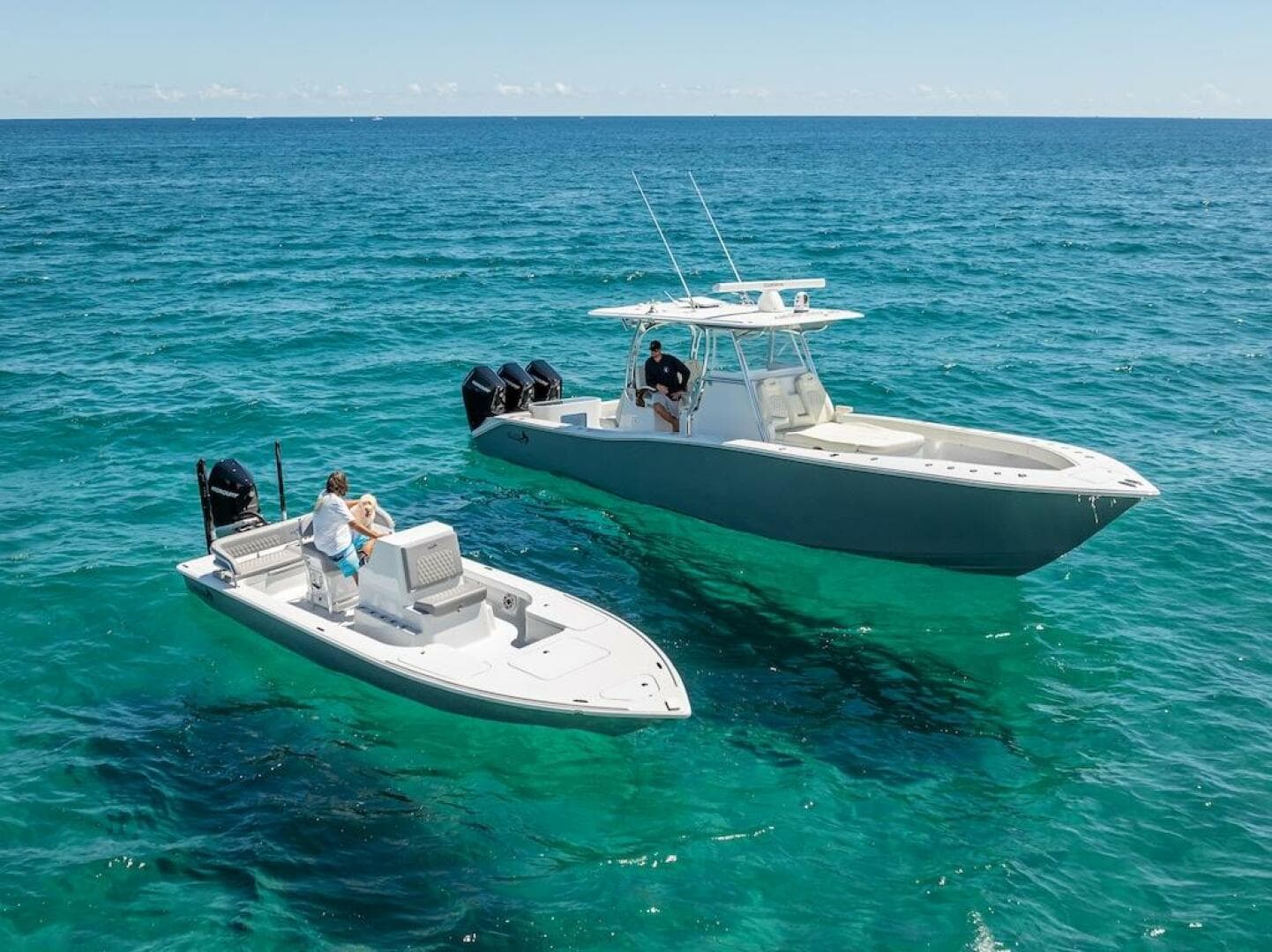 2025 Billfish 39 Center Console with Tower on clear blue ocean.