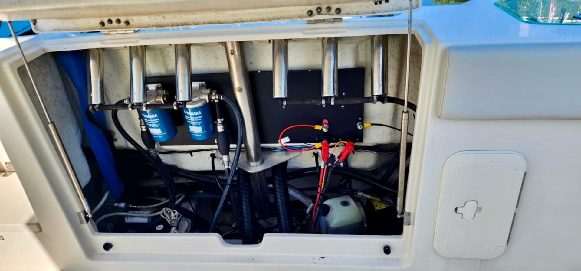 2021 Sailfish 272 CC boat engine compartment with wiring and filters.