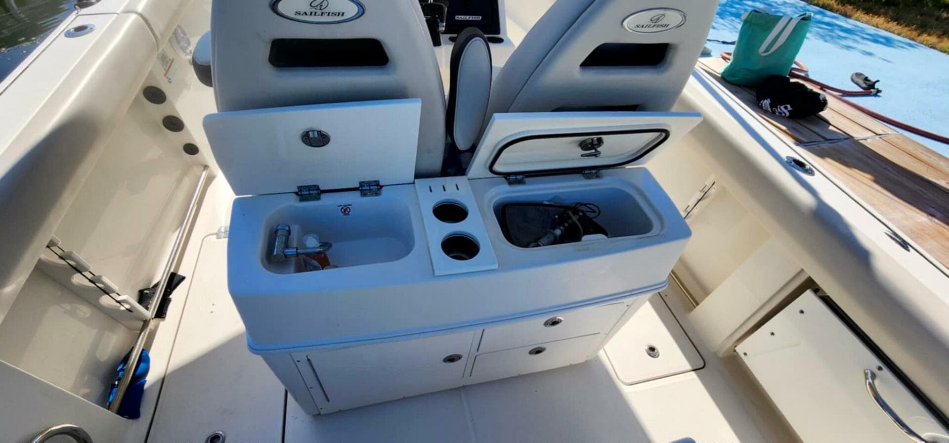 2021 Sailfish 272 CC boat interior with storage compartments and seating.